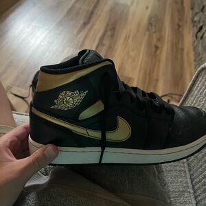 Air Jordan Black and Gold High-Top Sneakers